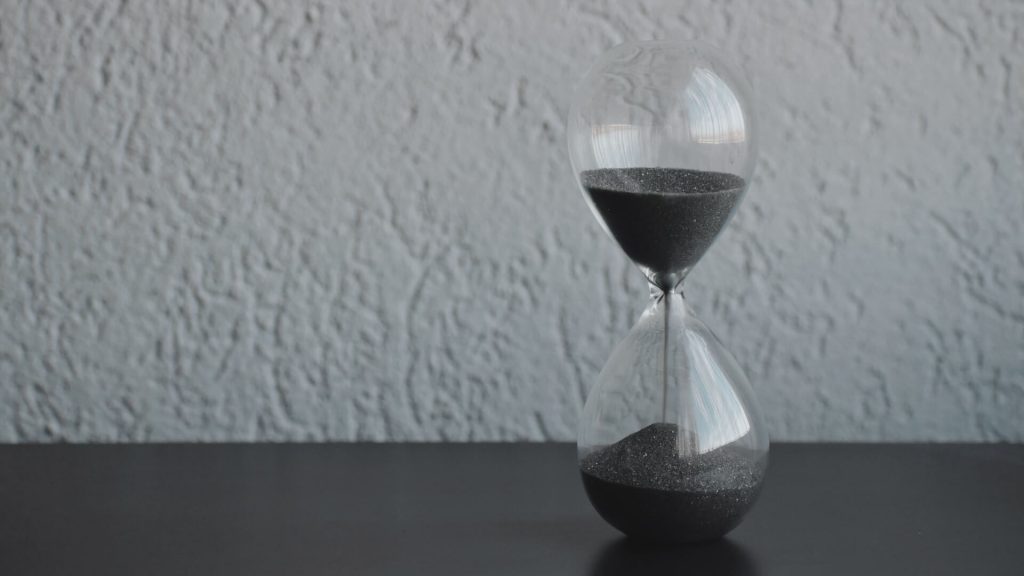 A classic hourglass, symbolizing the passage of time and often used as a metaphor for patience and precision.